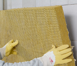 Close-up of StoTherm Mineral wool board being installed