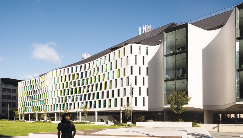 Curved white rendered facade of UTS Thomas Street, Sydney, clad in StoVentec R